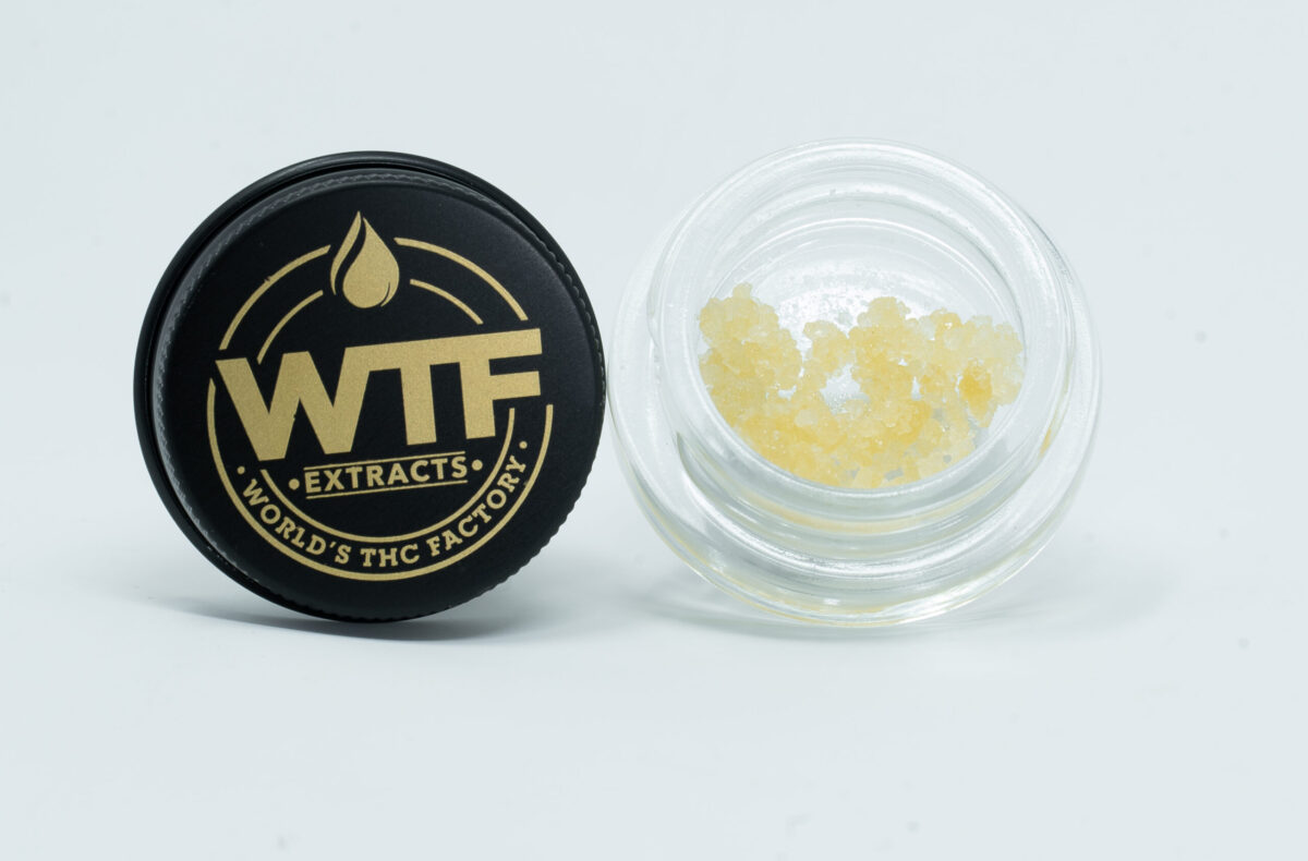 High-quality WTF cannabis sugar with a crystalline texture in a sleek ja
